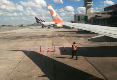 a man standing in front of a plane