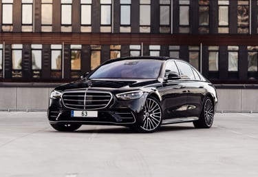 Mercedes-Benz parked at a venue, representing premium private transport services by JS Slachta Limo