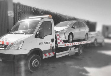 a tow truck with a flat bed and a flat bed