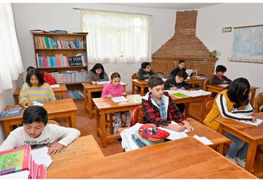 a group of children in a classroom in the Muslim School