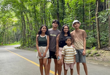 A group of people in the Man-made Forest of Bohol, Philippines.