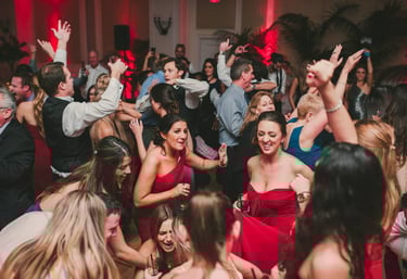 a group of people dancing at a party