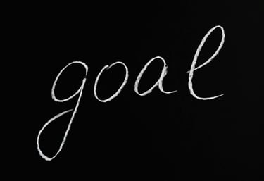 le mot goal sur fond noir pour atteindre des objectifs