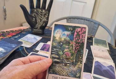 the lovers tarot card and a palm statue with the lines
