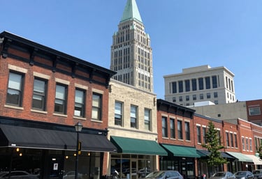 A vibrant city street bustling with people and local shops.