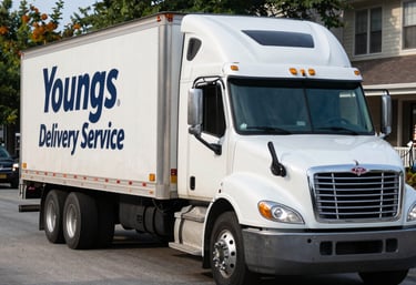 Delivery van parked outside a Chicago suburb business during pickup.