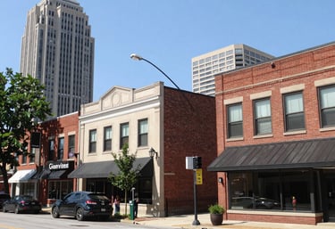 A vibrant city street bustling with people and local shops.