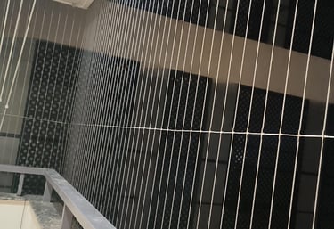 A sleek invisible grill installed on a window, offering security without blocking the view.