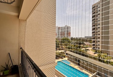 Close-up of a balcony safety net installed on a modern apartment building.