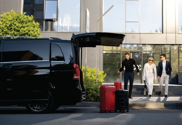 a van parked in front of a building with a woman in white