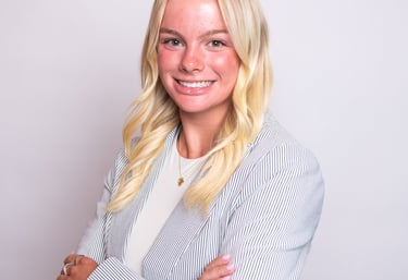 Headshot of Whitney showcasing a friendly, approachable expression.