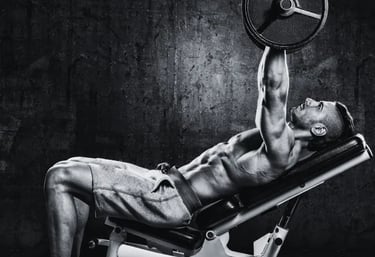a man doing a incline bench press in a gym