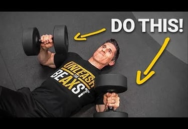 a man doing a dumbell press on floor