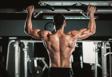 a man with a muscular body and a barbell