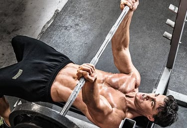 a man doing a barbell reverse grip bench press exercise on a bench