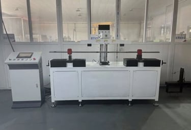 Tensile strength testing performed on barbell shafts for load performance