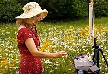 Live wedding painter working on a painting, commissioned by the bride and groom, wedding planner.