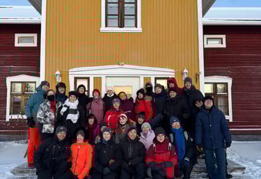 a group of people standing in front of a house