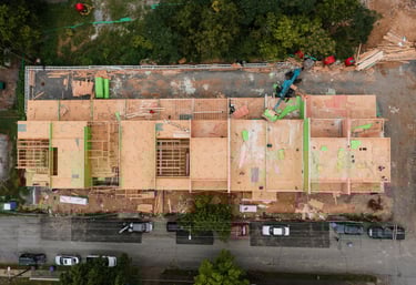 a building being built into a commercial complex with a roof that is being built into a