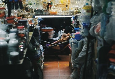 Market vendor relaxing in Saigon