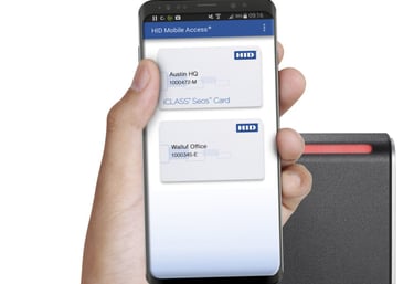 a person holding a cell phone in their hand