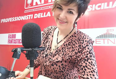 a woman in a leopard print blouse and a microphone