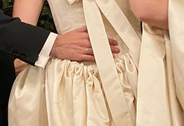 a man and woman in wedding dresses and tuxedos