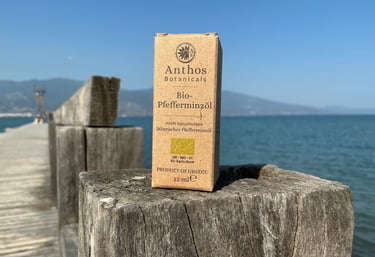 a box of peppermint essential oil on a wooden fence