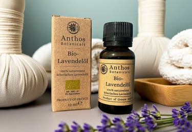 a bottle and a box of lavender essential oil and lavender flowers