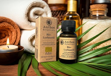 a bottle of laurel bay essential oil with candled candles