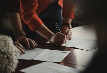 People signing documents