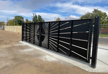 Decorative lot entrance gate with sun pattern