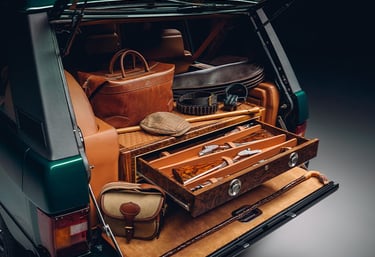 Range rover trunk open with drawers and hunting gear