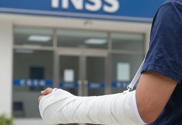 Justice scales balanced on a wooden desk with legal books in the background.