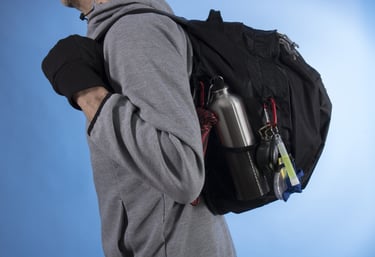 a man with a bugout backpack on his back