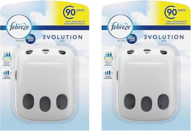 Two Febreze 3Volution plug-in air freshener diffusers in retail packaging for 90-day odor elimination.