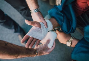 a man is holding a bandage in his hand
