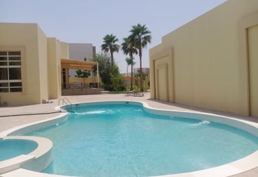 a pool with a swimming pool and a lounge area