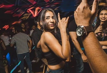 a woman in a black top and jeans jeans and a watch