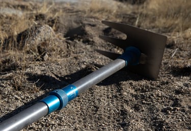 a shoveled shovel with a metal handle and a blue handle
