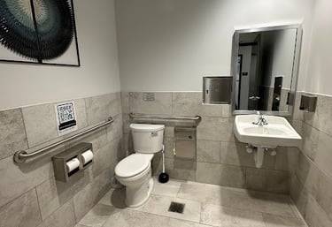 <img src="bathroom-remodel.jpg" alt="Modern commercial bathroom renovation with new tile flooring and fixtures by Retail Work