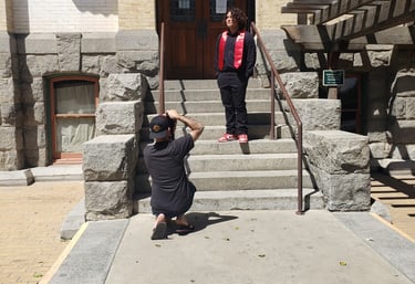 Taking a picture of a client on top of stairs