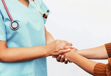 female doctor holding the hands of a patient