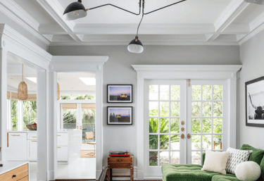 garnet_Painting a living room with a green sofa, lamps and fine carpentry design on the ceiling