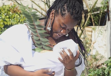 a woman holding a baby in her arms