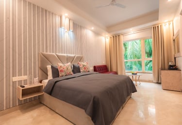 a bedroom with a bed and a couch