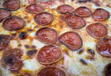 a perfectly cooked wood fire pizza with beautiful pepperoni