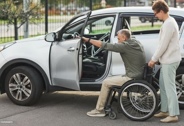 Support worker assisting a man in a wheelchair as he transfers into a white car for community access