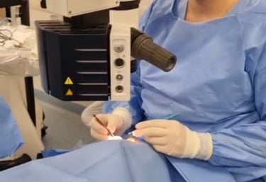 a woman in a surgical mask and a surgical instrument