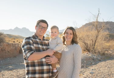 Kody Daffer with his wife Kylie and their young son, a Nampa, Idaho family, smiling together outdoor